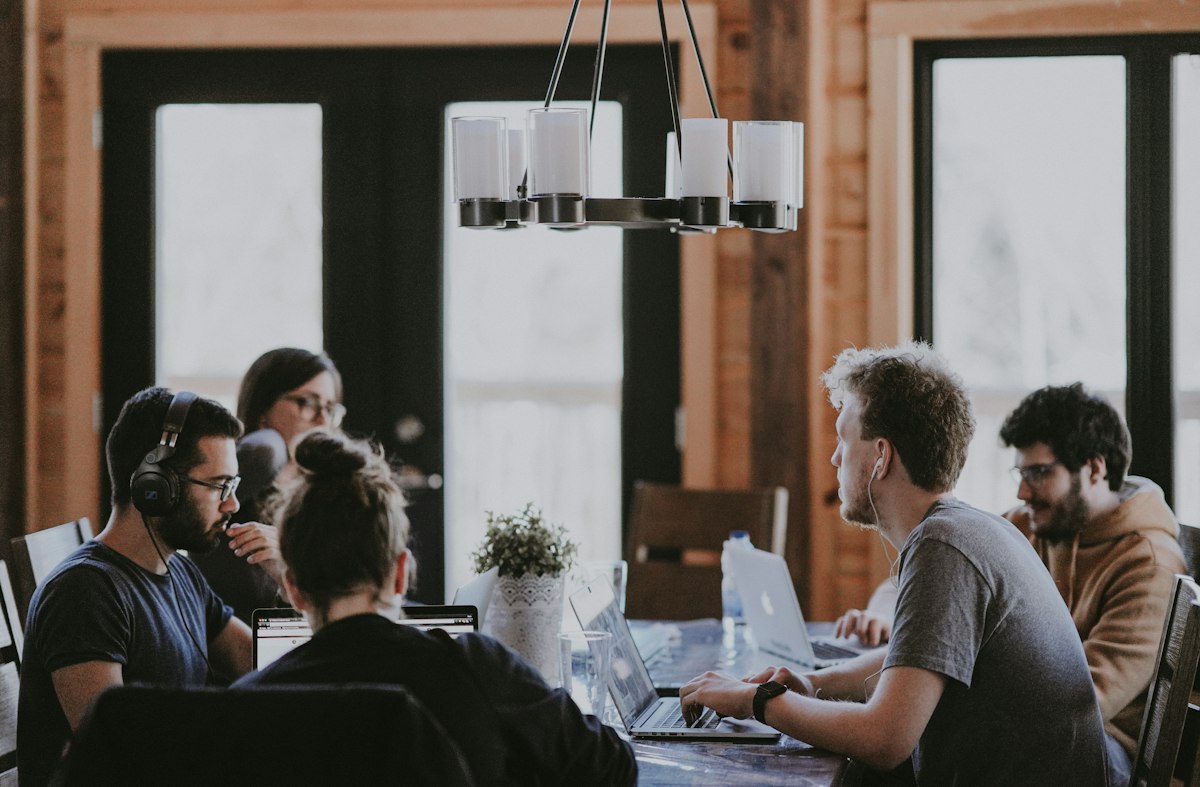Colleagues reviewing documents together at a meeting table